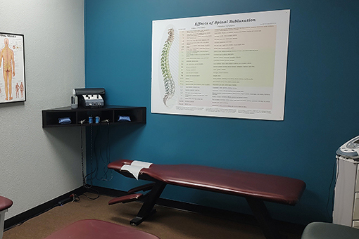 Chart, Equipment and Bed in a Pregnancy Chiropractor's Clinic Near Phoenix and Tolleson Arizona