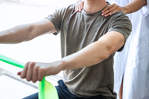 Phoenix Man Doing Rehabilition Exercise for His Sports Injury with Guidance from Tolleson Chiropractor