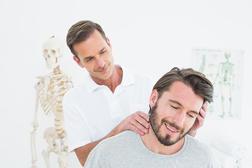 Chiropractor Checking Neck of a Survivor of a Motor Vehicle Accident in Phoenix Arizona