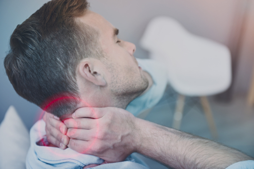 Man Holding Neck Hurt During Motorcycle Accident In Need of Chiropractor in Tolleson AZ