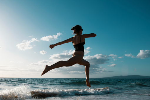 Lady Enjoying The Beach After Tolleson Chiropractor Helped Her Recover From Personal Injury