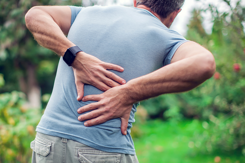 Middle-aged Man In Need of Chiropractor for Disc Injuries Near His Phoenix AZ Home