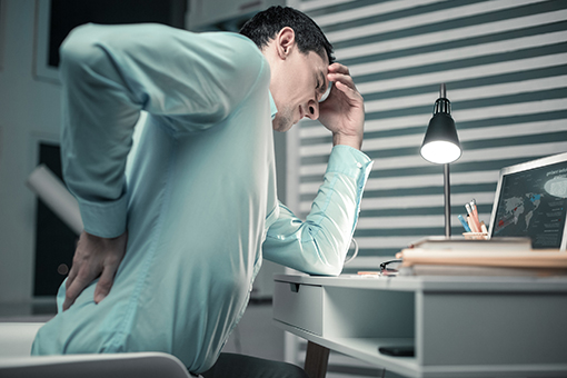 Phoenix Man Suffering Back Pain Contemplating Whether To Visit Chiropractor for Disc Injuries or Not