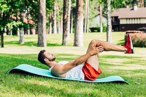 Man Exercising In Front of His Phoenix AZ House After Completing Sessions with Chiropractor for His Disc Injuries