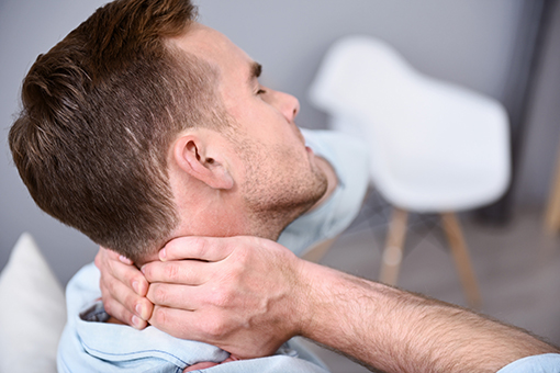 Man with Neck Injury Thinking of Visiting Chiropractor Around Maryvale AZ