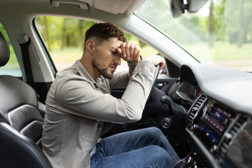 Man Paused Driving Due To Headache In Need of Accident Chiropractor in Tolleson Arizona