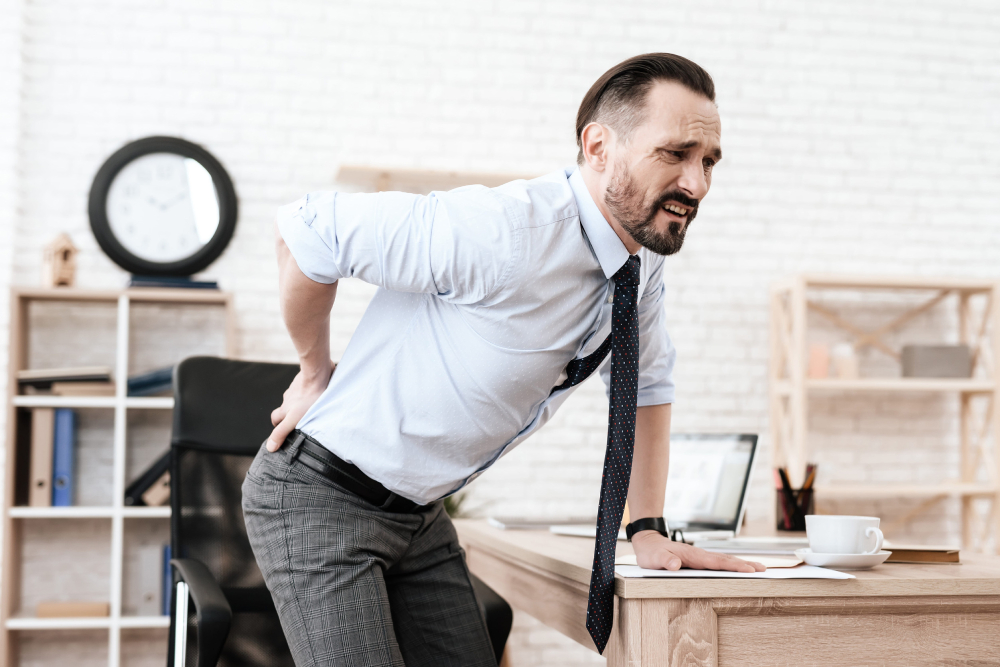 Man Suffering From a Work Injury Leaving Office To Go To Chiropractor in Tolleson AZ