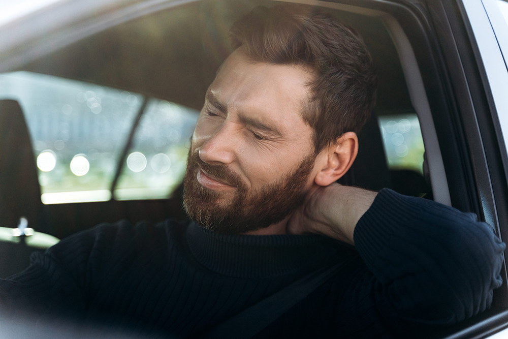 Phoenix Arizona Man Suffering Whiplash Injury While Driving In Need of Treatment Clinic Near Him