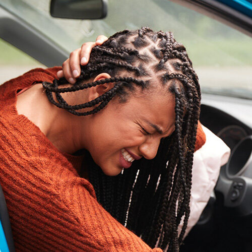 Lady from Tolleson AZ Getting Out of Car To Visit Phoenix Chiropractor for Whiplash Treatment